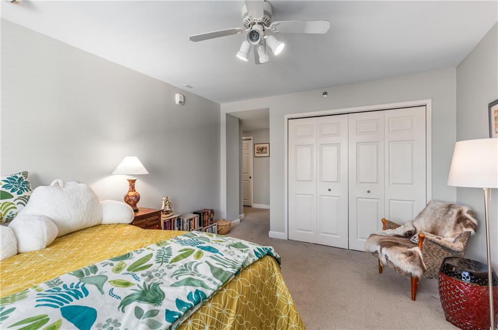 1501 Clairmont Road, Unit 535 Decatur, GA 30033 - Photo 20 of 34 a bedroom with a bed and a chandelier