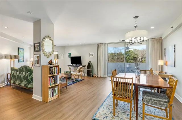 a view of a dining room with furniture window and wooden floor