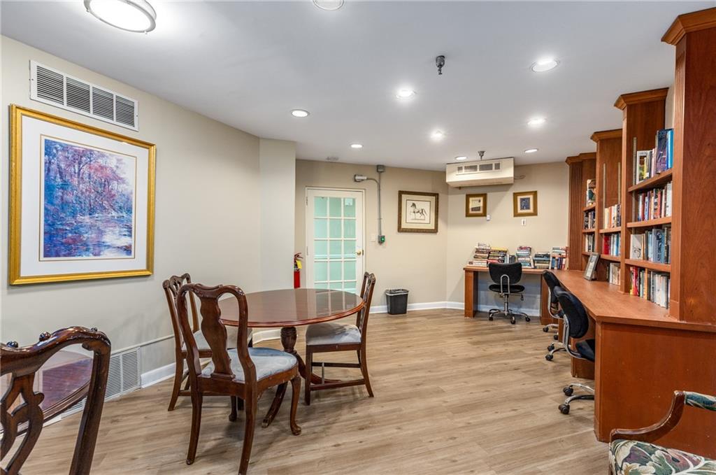 1501 Clairmont Road, Unit 535 Decatur, GA 30033 - Photo 30 of 34 a view of a a dining room with furniture window and wooden floor