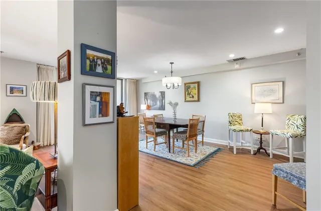 a view of a dining room with furniture and wooden floor