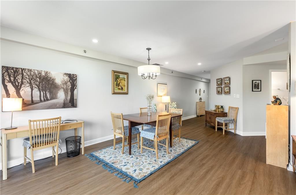 1501 Clairmont Road, Unit 535 Decatur, GA 30033 - Photo 7 of 34 a living room with furniture a dining table and a fireplace