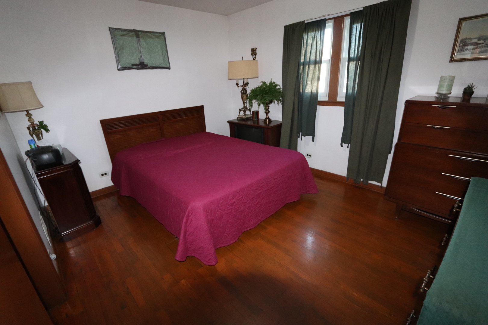 4919 Long Avenue Chicago, IL 60638 - Photo 14 of 29 a bedroom with a bed and a dresser