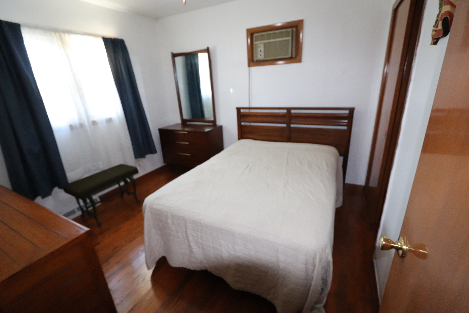 4919 Long Avenue Chicago, IL 60638 - Photo 15 of 29 a bedroom with a bed and a flat tv screen on a dresser