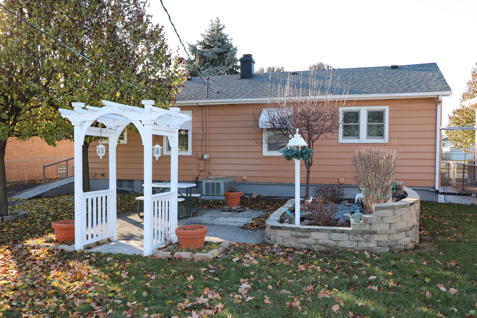 4919 Long Avenue Chicago, IL 60638 - Photo 3 of 29 a front view of a house with garden