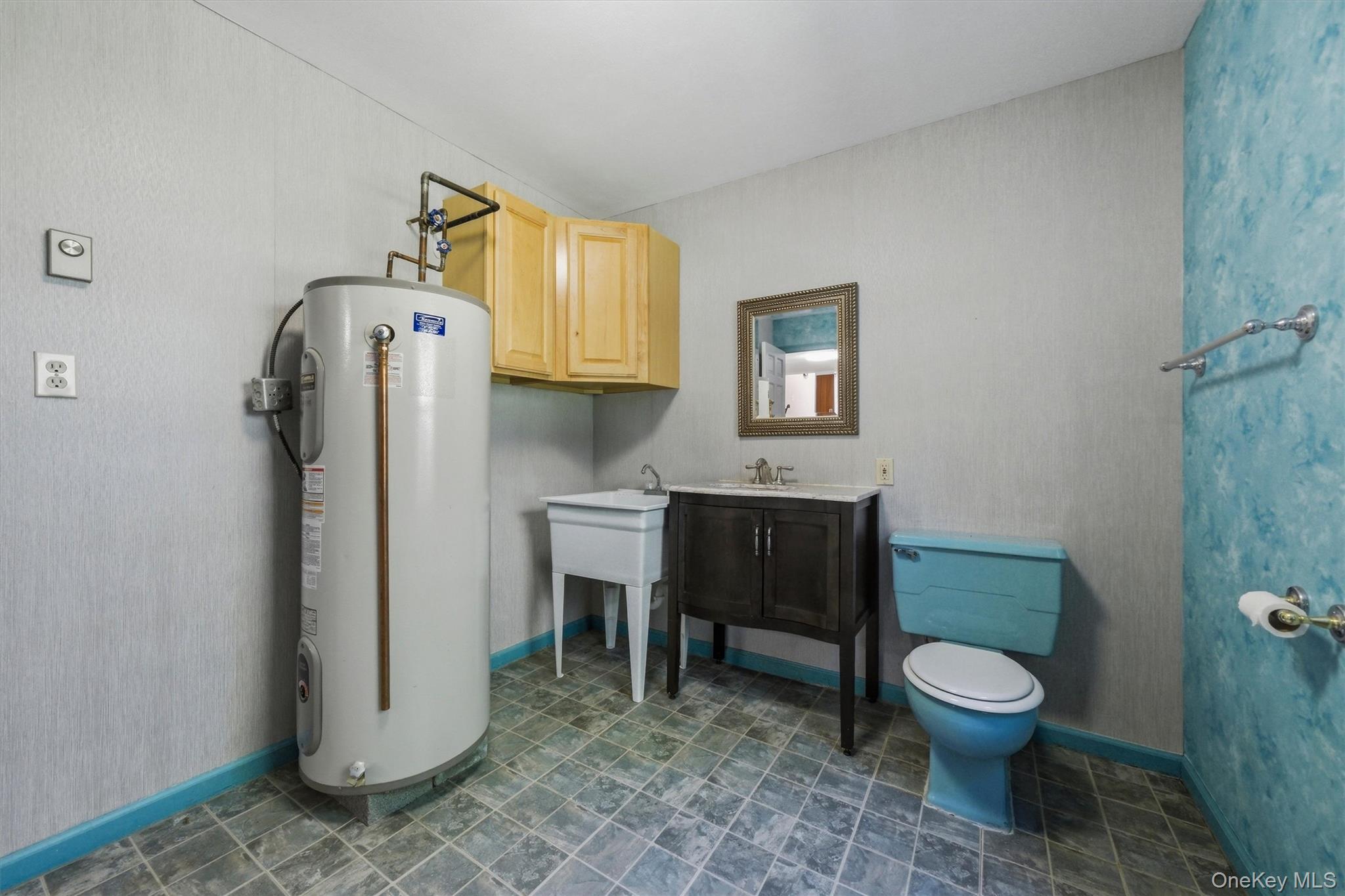 75 Pleasant Ridge Drive Poughkeepsie, NY 12603 - Photo 22 of 47 Laundry room with half bath and laundry tub