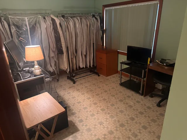 a backyard of a house with table and chairs