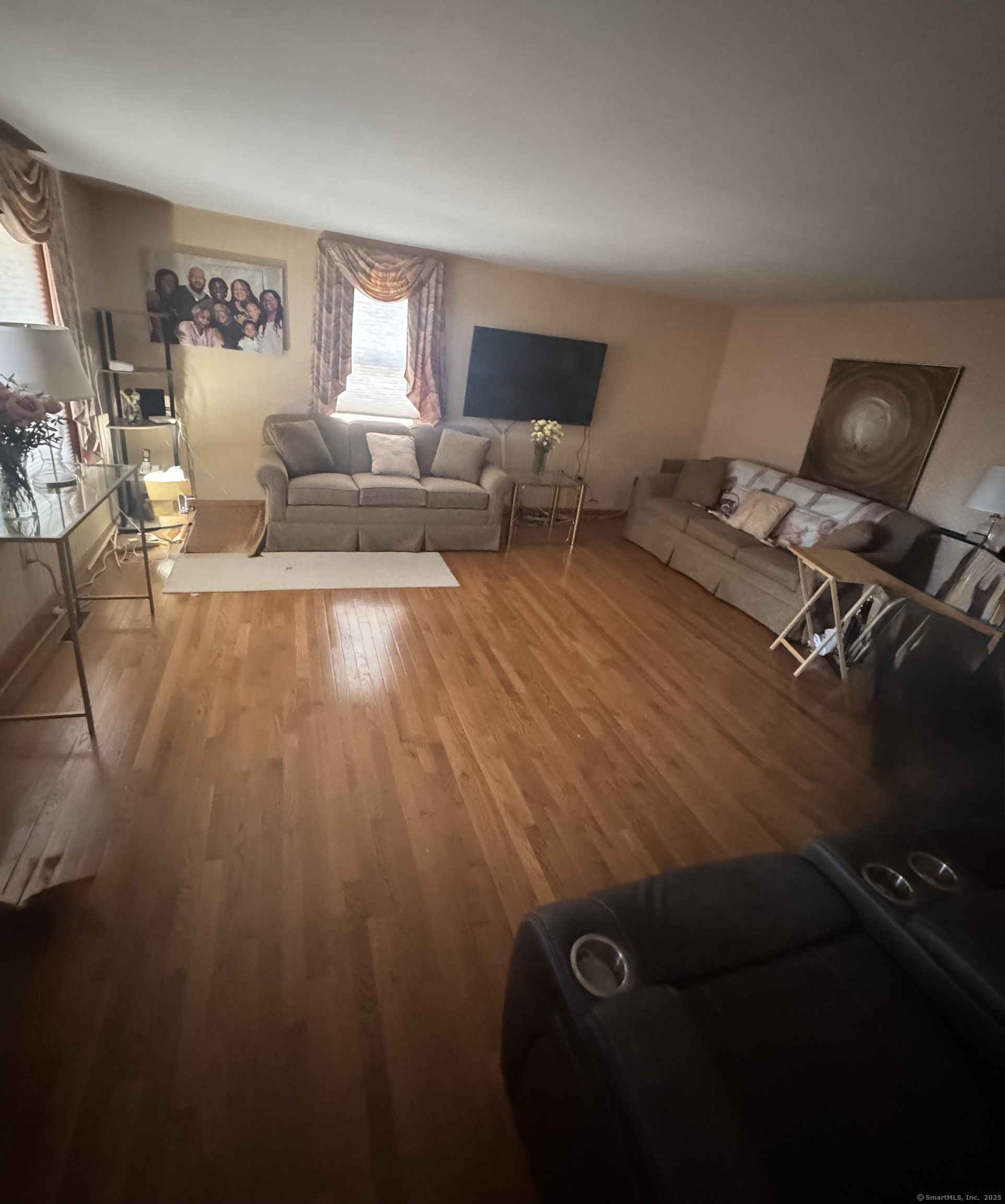 222 1/2 North State Street Ansonia, CT 06401 - Photo 2 of 14 a living room with furniture and a wooden floor