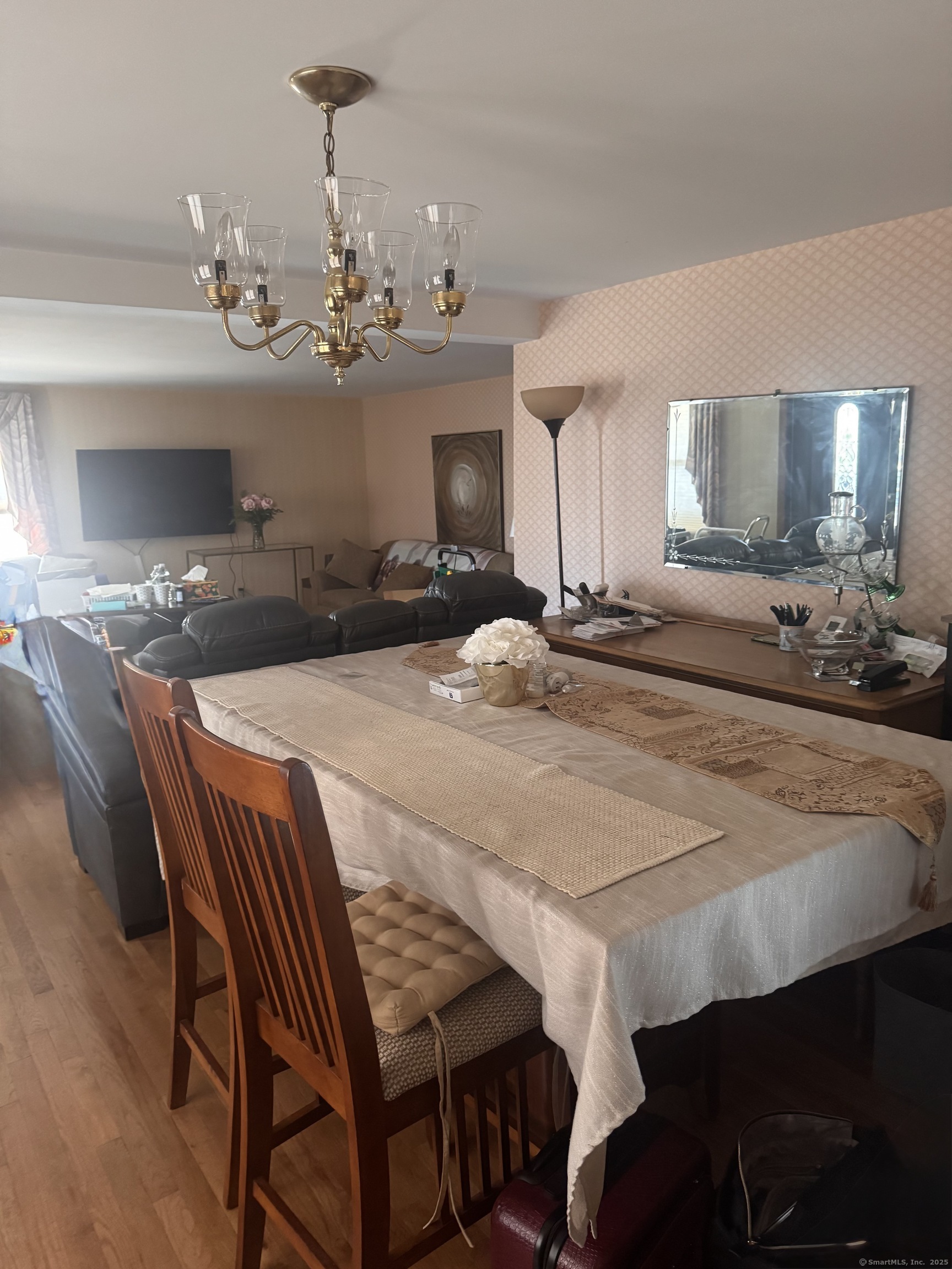 222 1/2 North State Street Ansonia, CT 06401 - Photo 4 of 14 a dining room with a table chairs and a chandelier