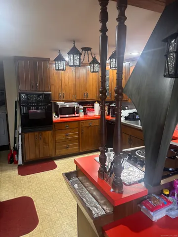a living room with hard wood flooring and gym equipment