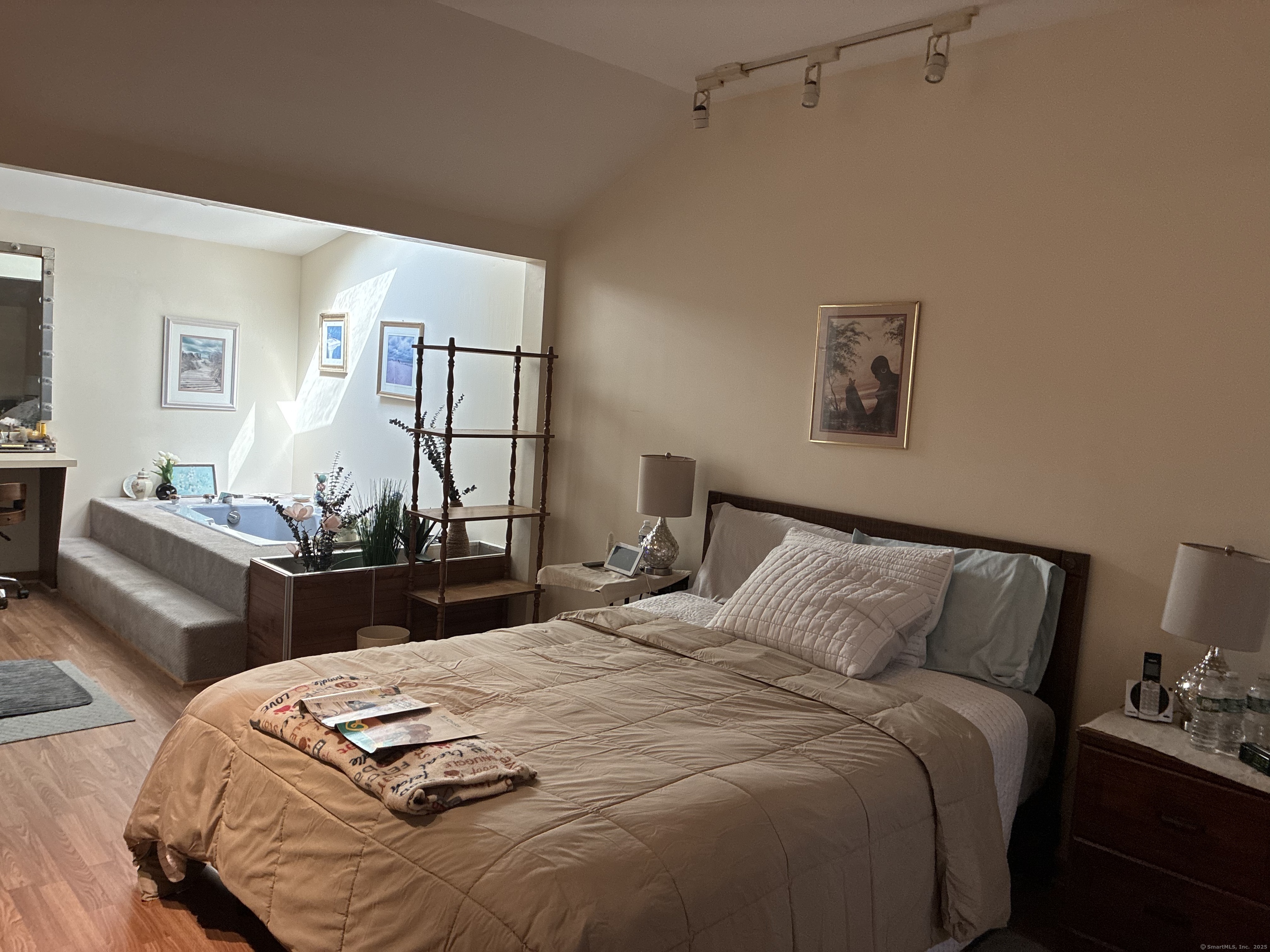 222 1/2 North State Street Ansonia, CT 06401 - Photo 8 of 14 a bedroom with bed and a night stand