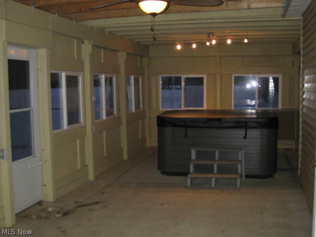 39199 Parsons Road Grafton, OH 44044 - Photo 22 of 25 The enclosed patio with the hot tub. Attached to the garage.