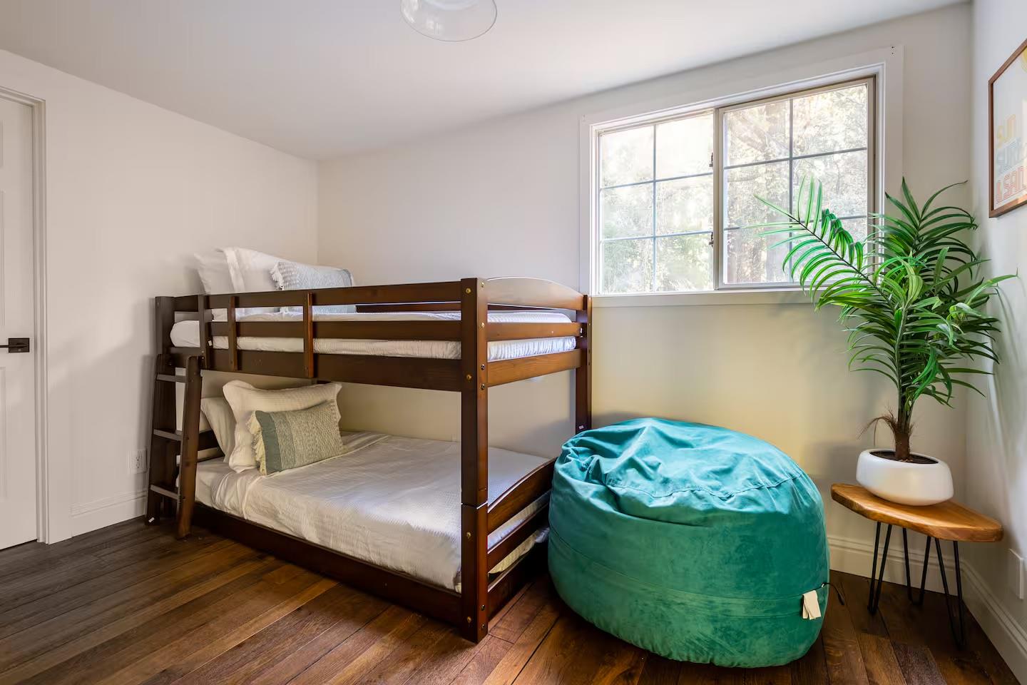 1003 Laurel Glen Road Soquel, CA 95073 - Photo 47 of 101 a bedroom with a bed a window and potted plant