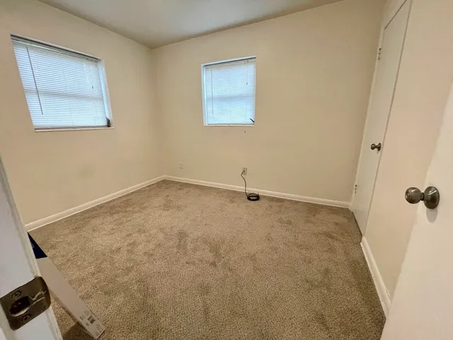 a view of a bathroom with a tub and shower