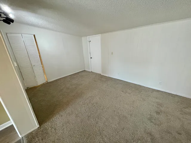 a view of bathroom with a sink and mirror