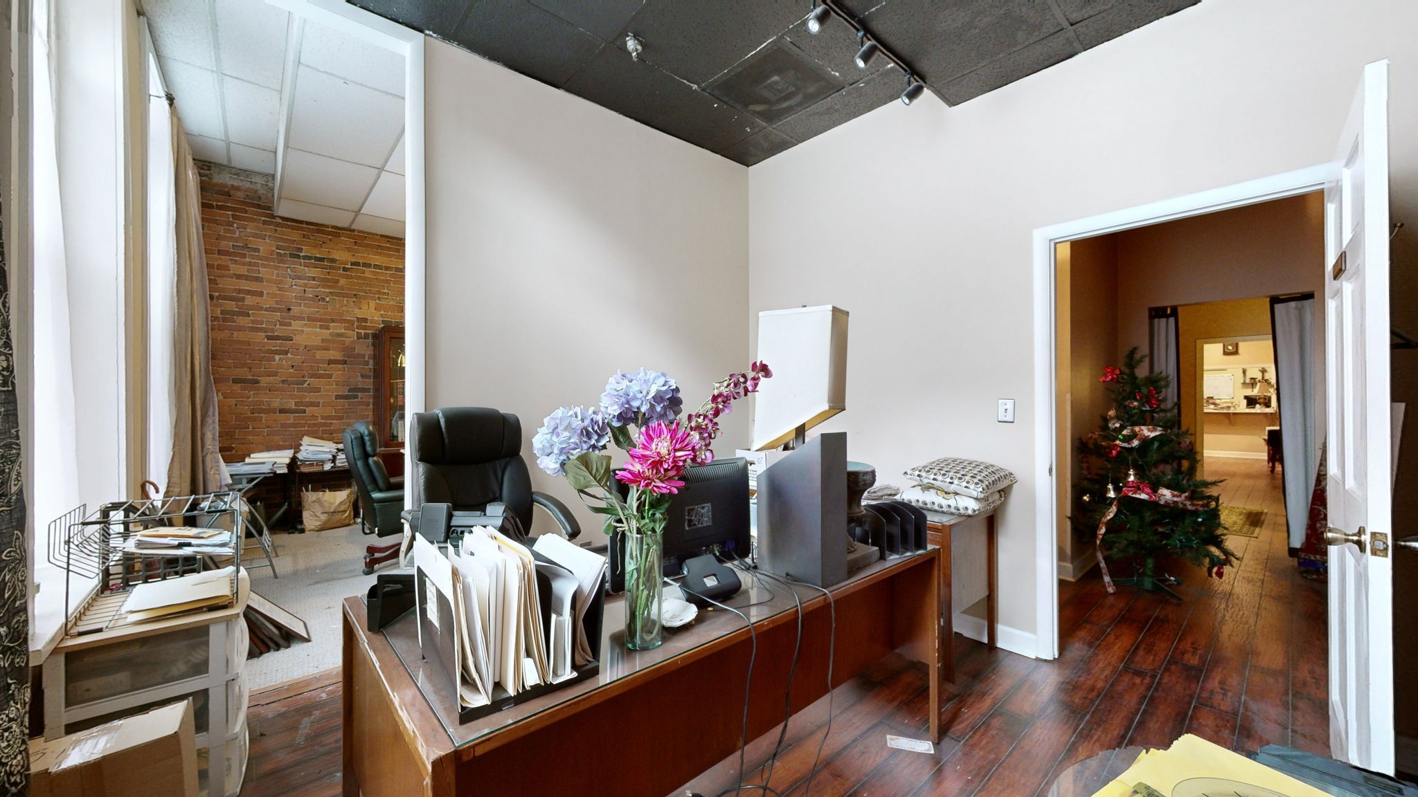 208 3rd Avenue North, Unit 400 Nashville, TN 37201 - Photo 13 of 40 a dining room with furniture and wooden floor