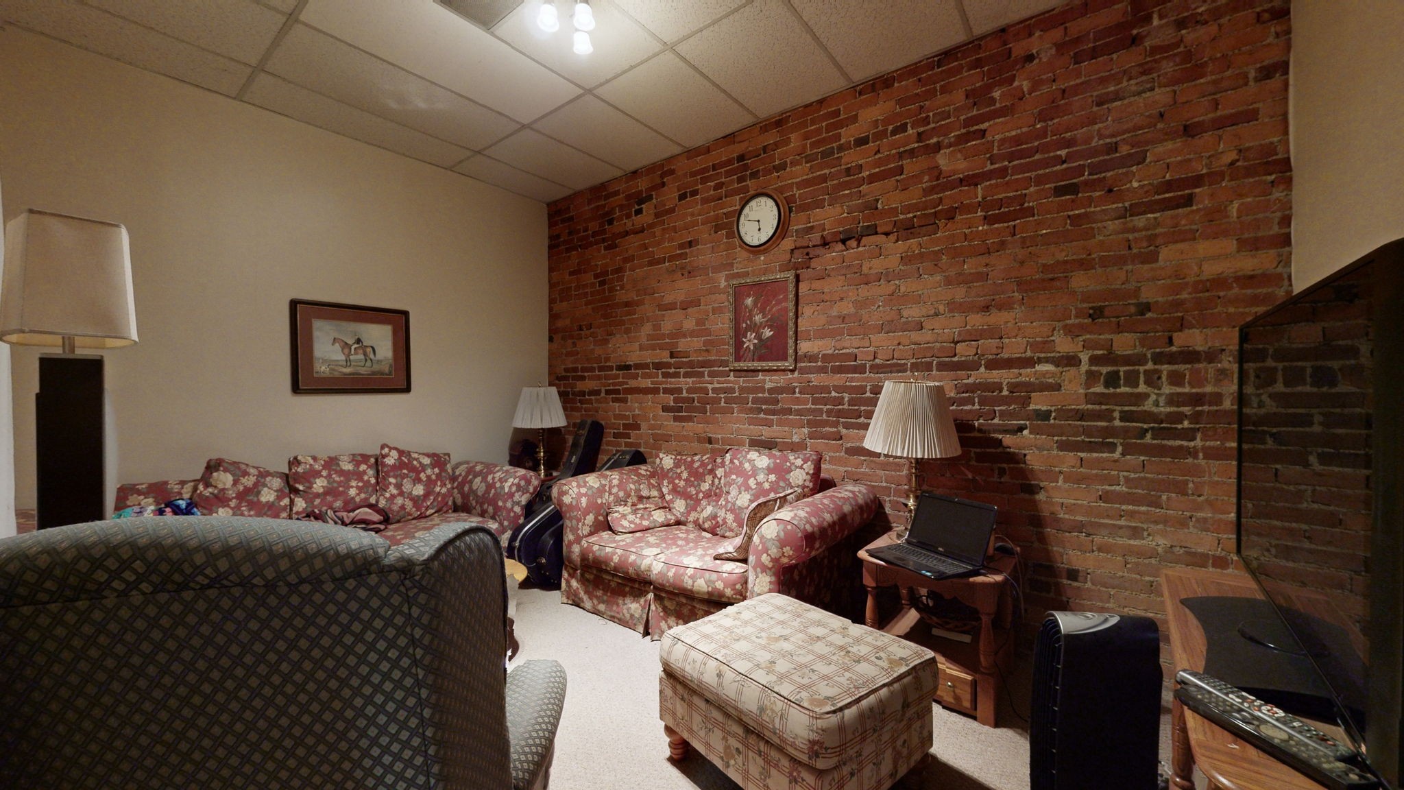 208 3rd Avenue North, Unit 400 Nashville, TN 37201 - Photo 21 of 40 a living room with furniture and a fireplace