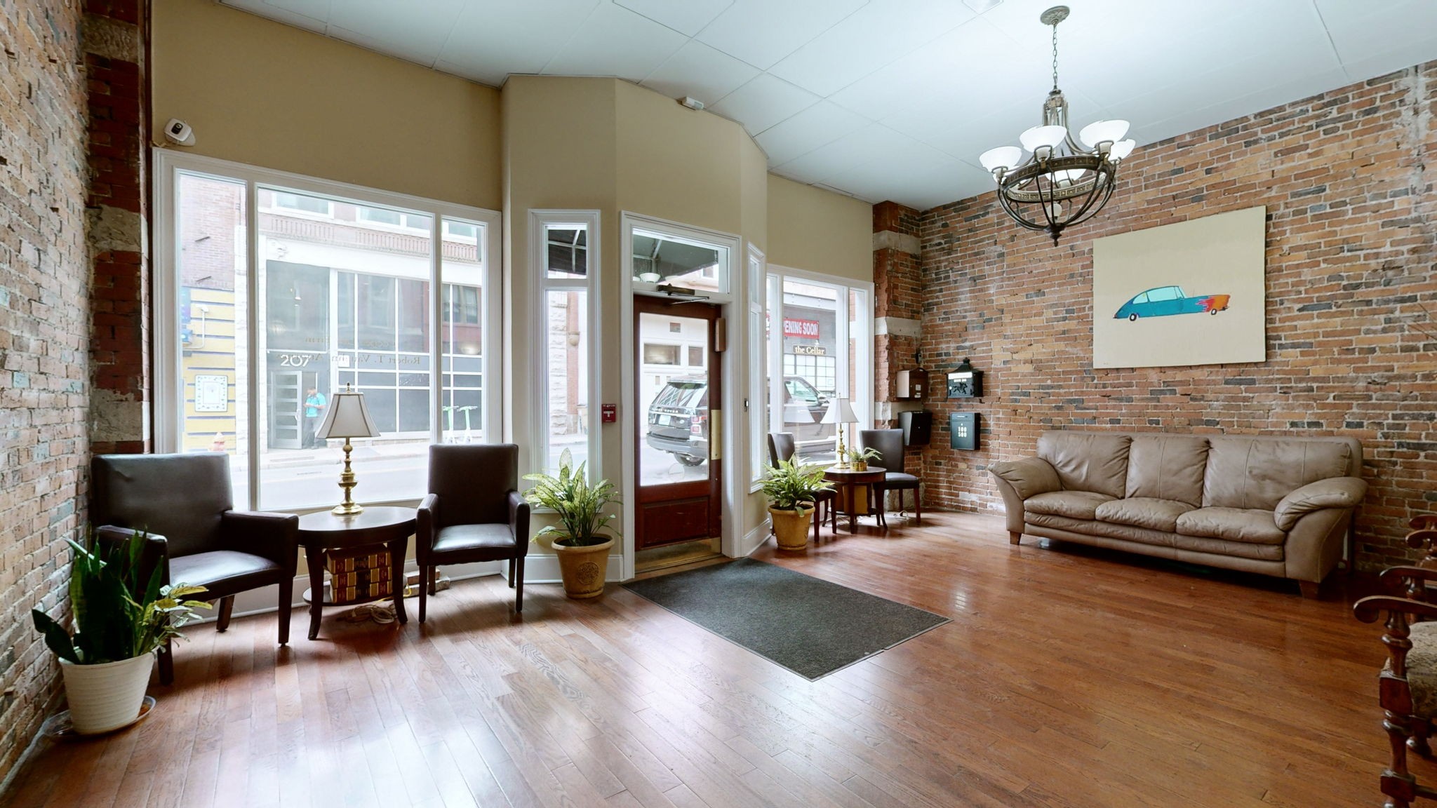 208 3rd Avenue North, Unit 400 Nashville, TN 37201 - Photo 3 of 40 a living room with furniture and wooden floor