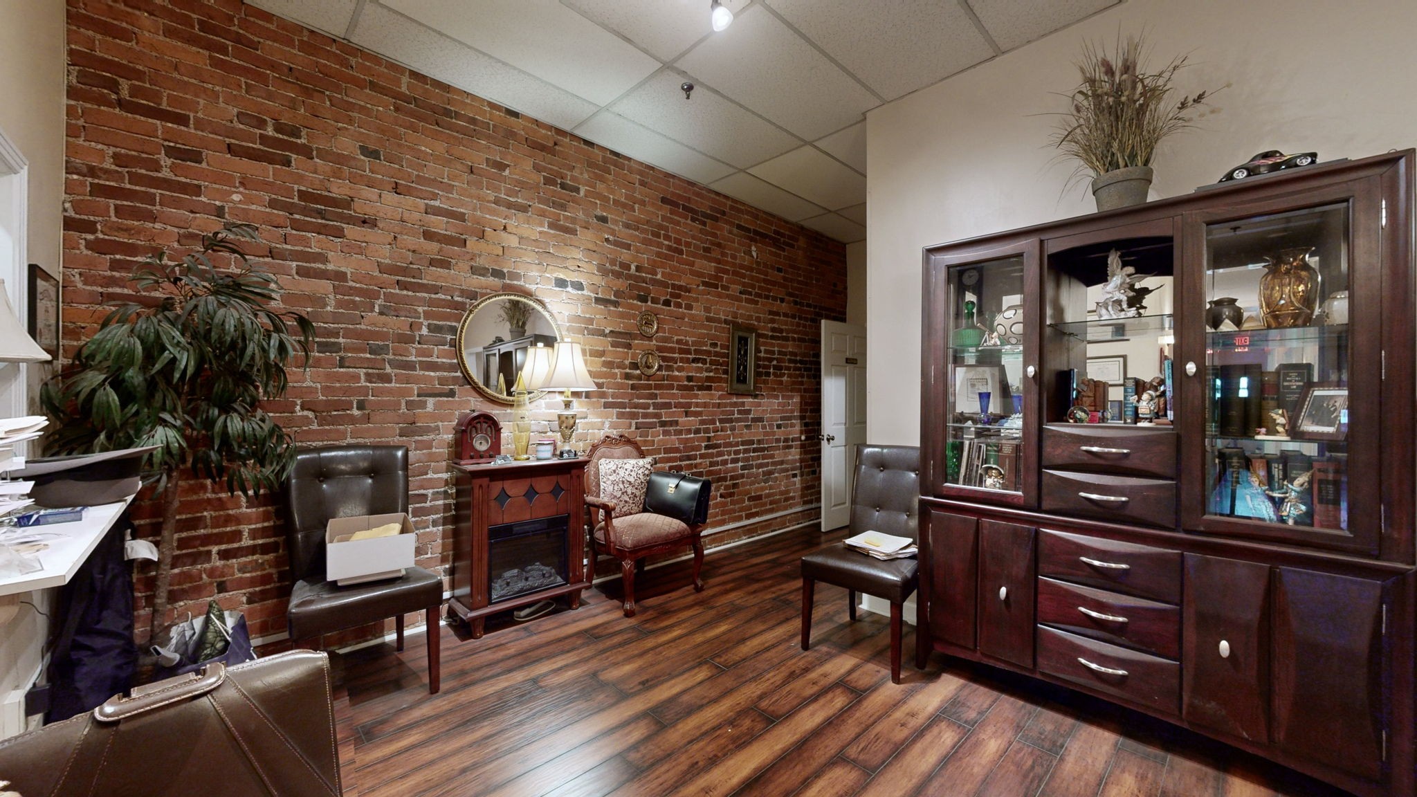 208 3rd Avenue North, Unit 400 Nashville, TN 37201 - Photo 10 of 40 a living room with furniture and a floor to ceiling window