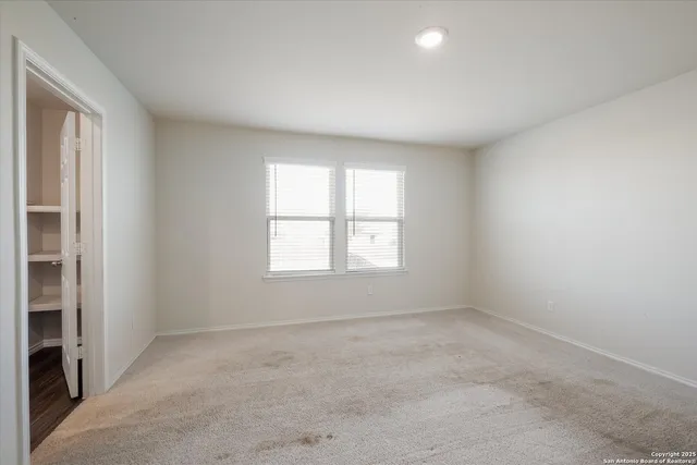 an empty room with windows