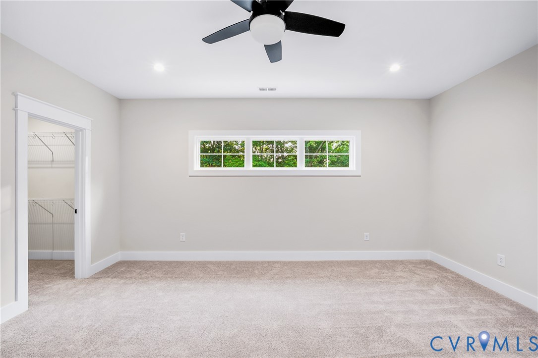 8299 Pamlico Road Ashland, VA 23005 - Photo 28 of 35 an empty room with a window and a ceiling fan
