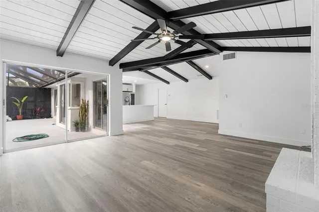 a kitchen with kitchen island a sink appliances and cabinets