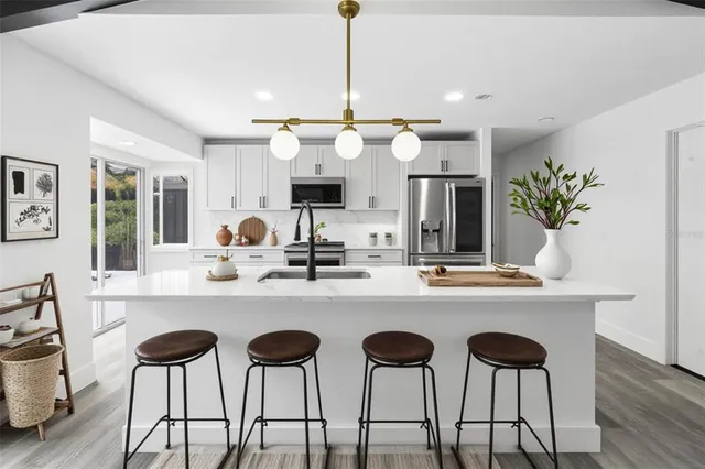 a large bathroom with a double vanity sink a mirror and a shower