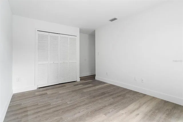 an aerial view of a house with garden space and street view