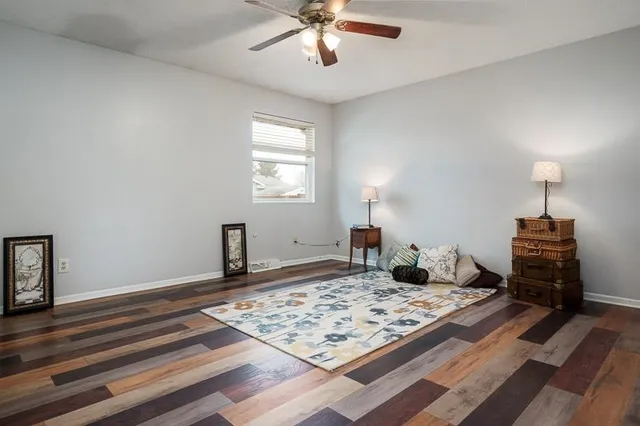 a bed room with a bed and a chandelier