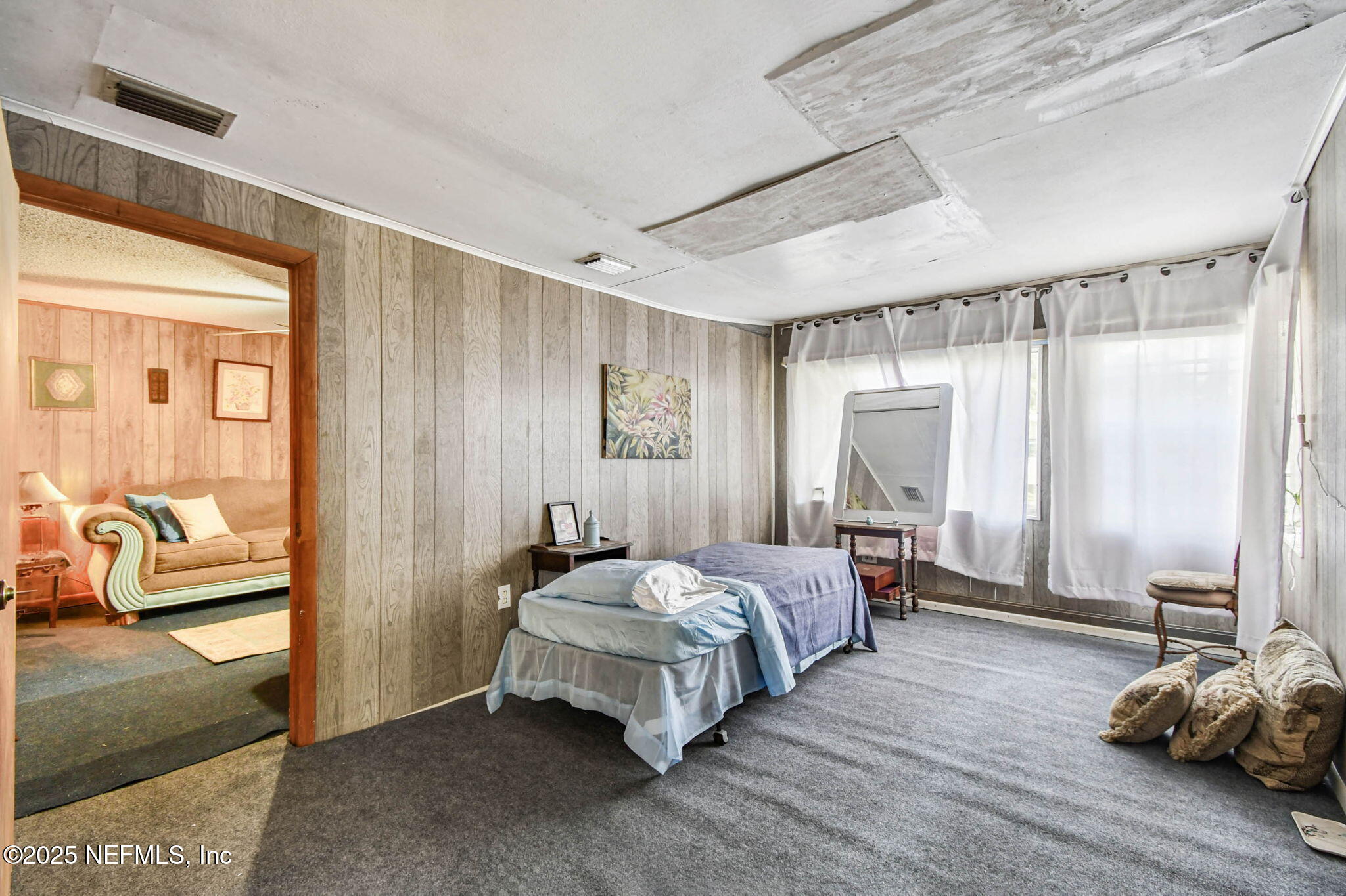 309 Hatten Lane Hastings, FL 32145 - Photo 22 of 28 a bedroom with a bed and wooden floor