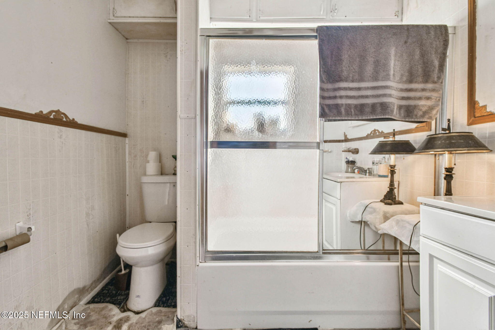 309 Hatten Lane Hastings, FL 32145 - Photo 26 of 28 a bathroom with a toilet and a shower