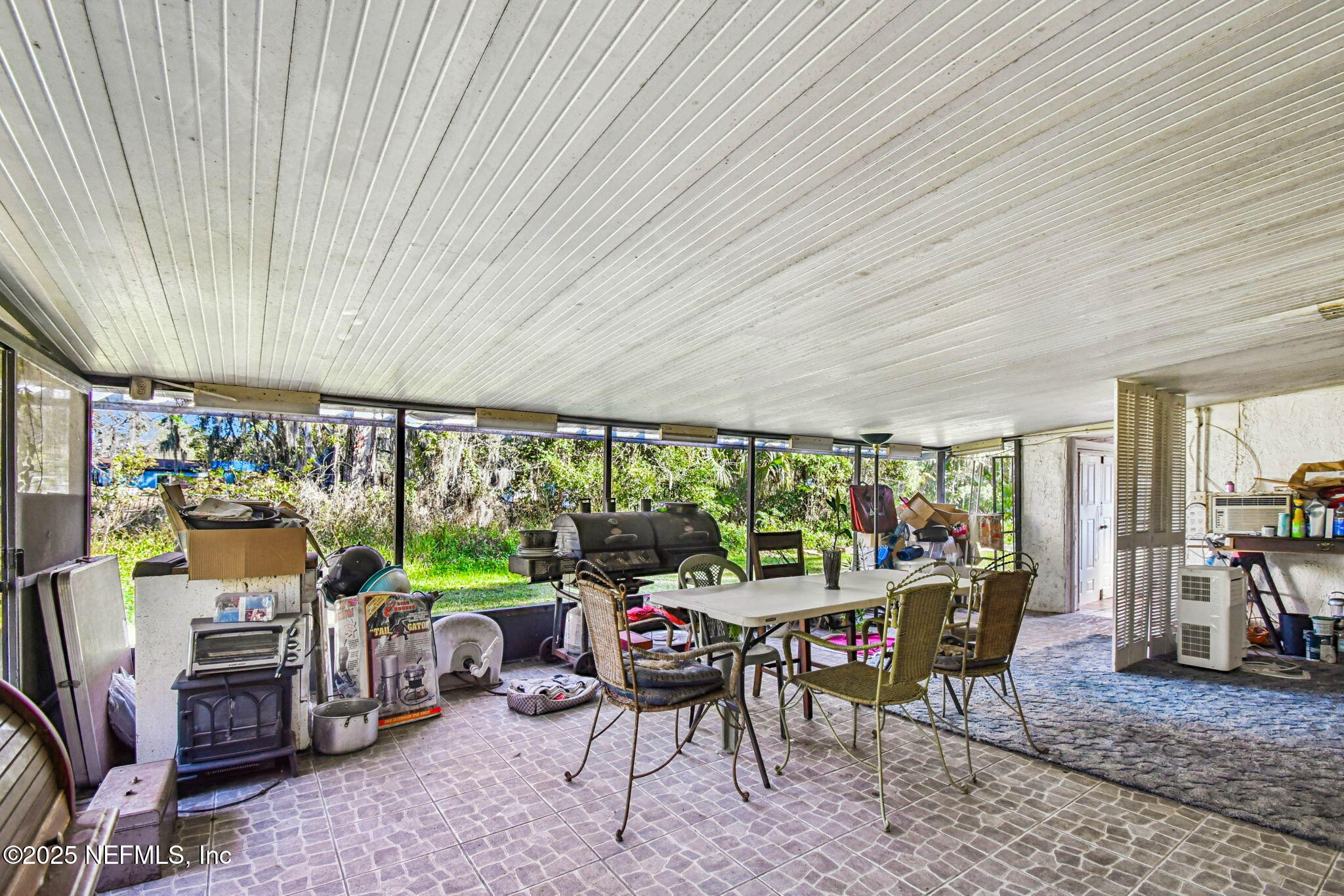 309 Hatten Lane Hastings, FL 32145 - Photo 8 of 28 a living room with furniture a window and a table