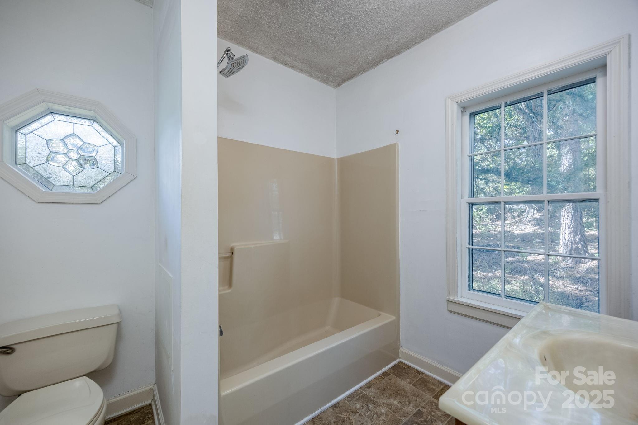 2086 State Rd S-20-19 Winnsboro, SC 29180 - Photo 20 of 30 a bathroom with a toilet and a bathtub