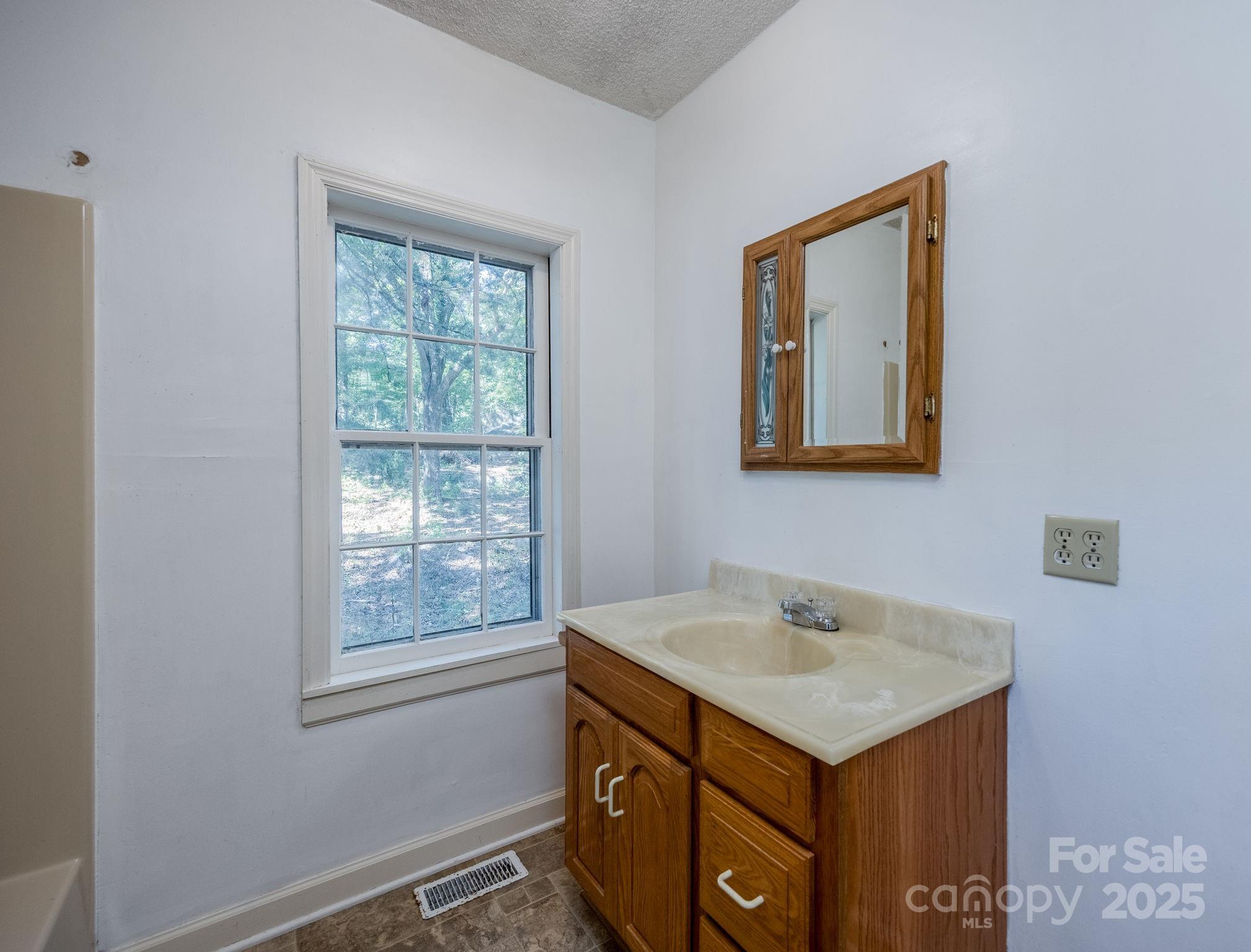 2086 State Rd S-20-19 Winnsboro, SC 29180 - Photo 21 of 30 a bathroom with a sink and a mirror