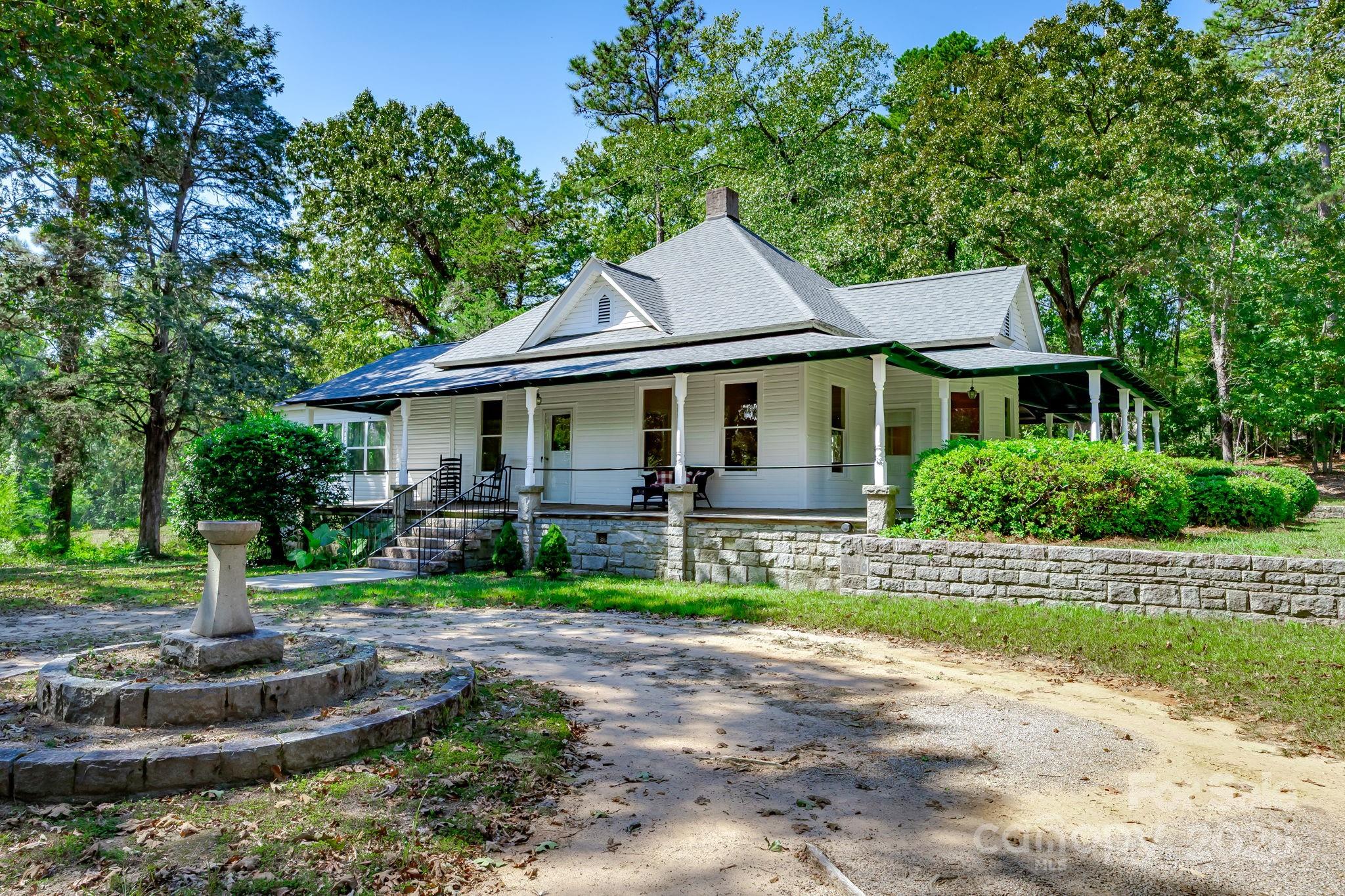 2086 State Rd S-20-19 Winnsboro, SC 29180 - Photo 3 of 30 a front view of a house with a yard