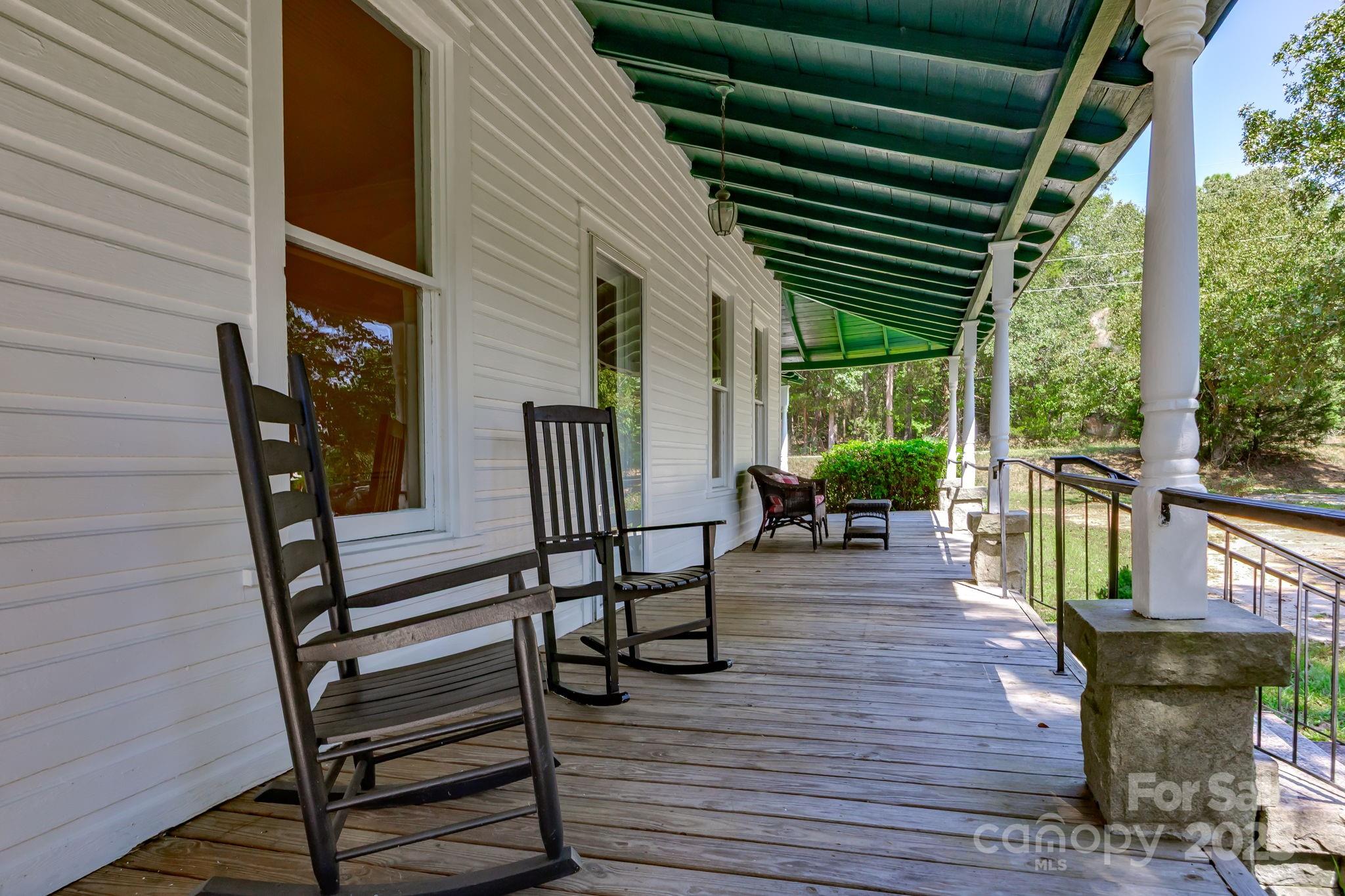 2086 State Rd S-20-19 Winnsboro, SC 29180 - Photo 4 of 30 a view of a porch with furniture and wooden floor