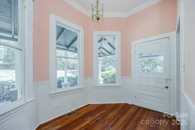 a bedroom with bed and a window