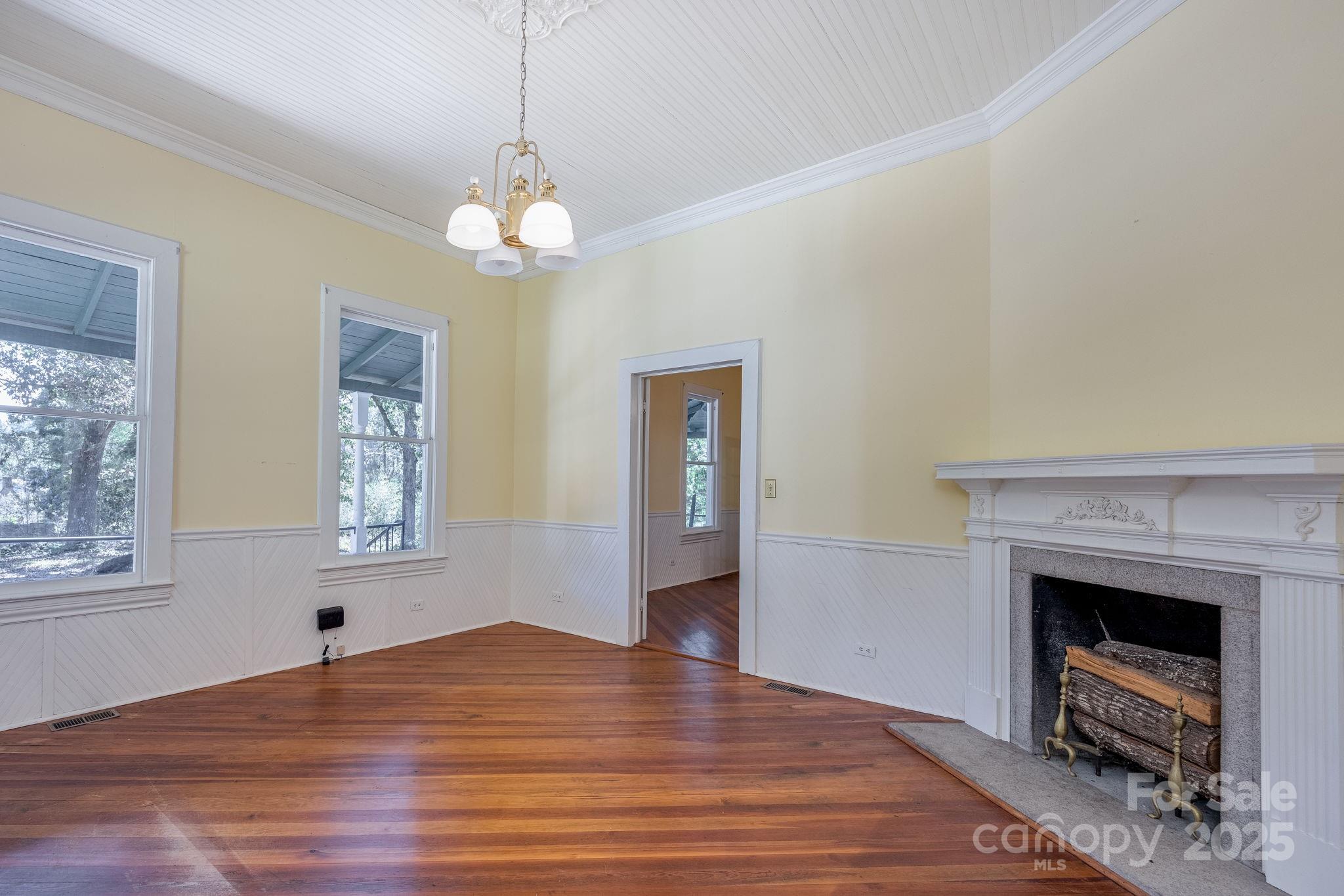 2086 State Rd S-20-19 Winnsboro, SC 29180 - Photo 10 of 30 a view of an empty room with a fireplace and a window