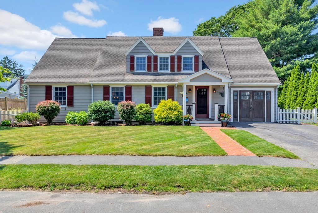 23 Leicester Road Marblehead, MA 01945 - Photo 1 of 42 a front view of a house with a yard and potted plants