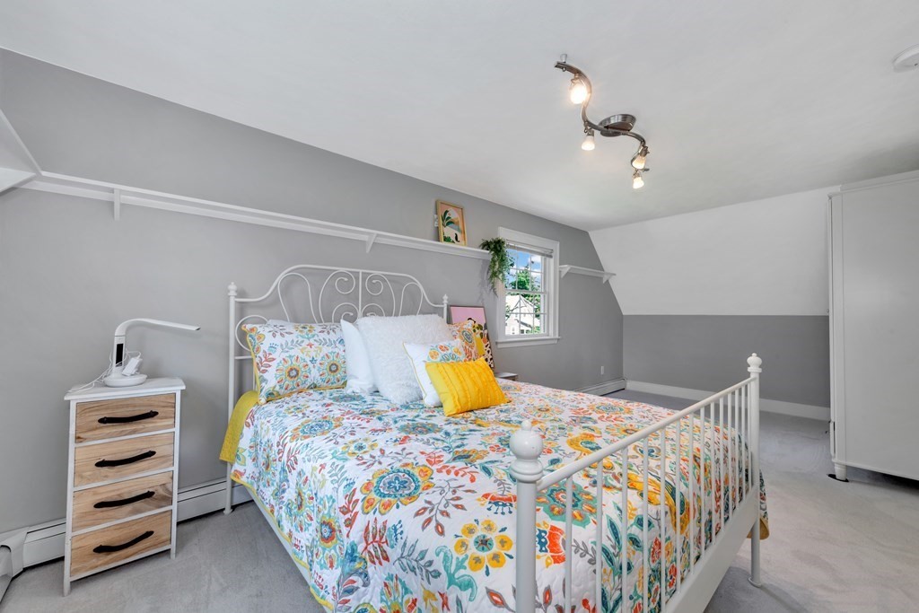 23 Leicester Road Marblehead, MA 01945 - Photo 34 of 42 a bedroom with a bed and dresser