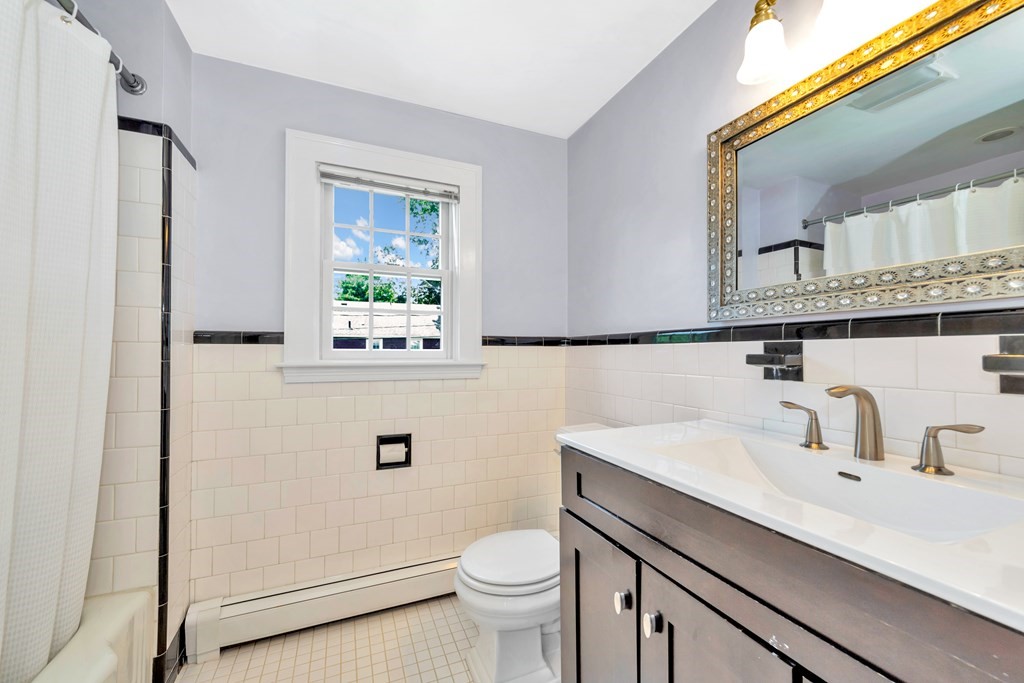23 Leicester Road Marblehead, MA 01945 - Photo 36 of 42 a bathroom with a sink vanity mirror and toilet