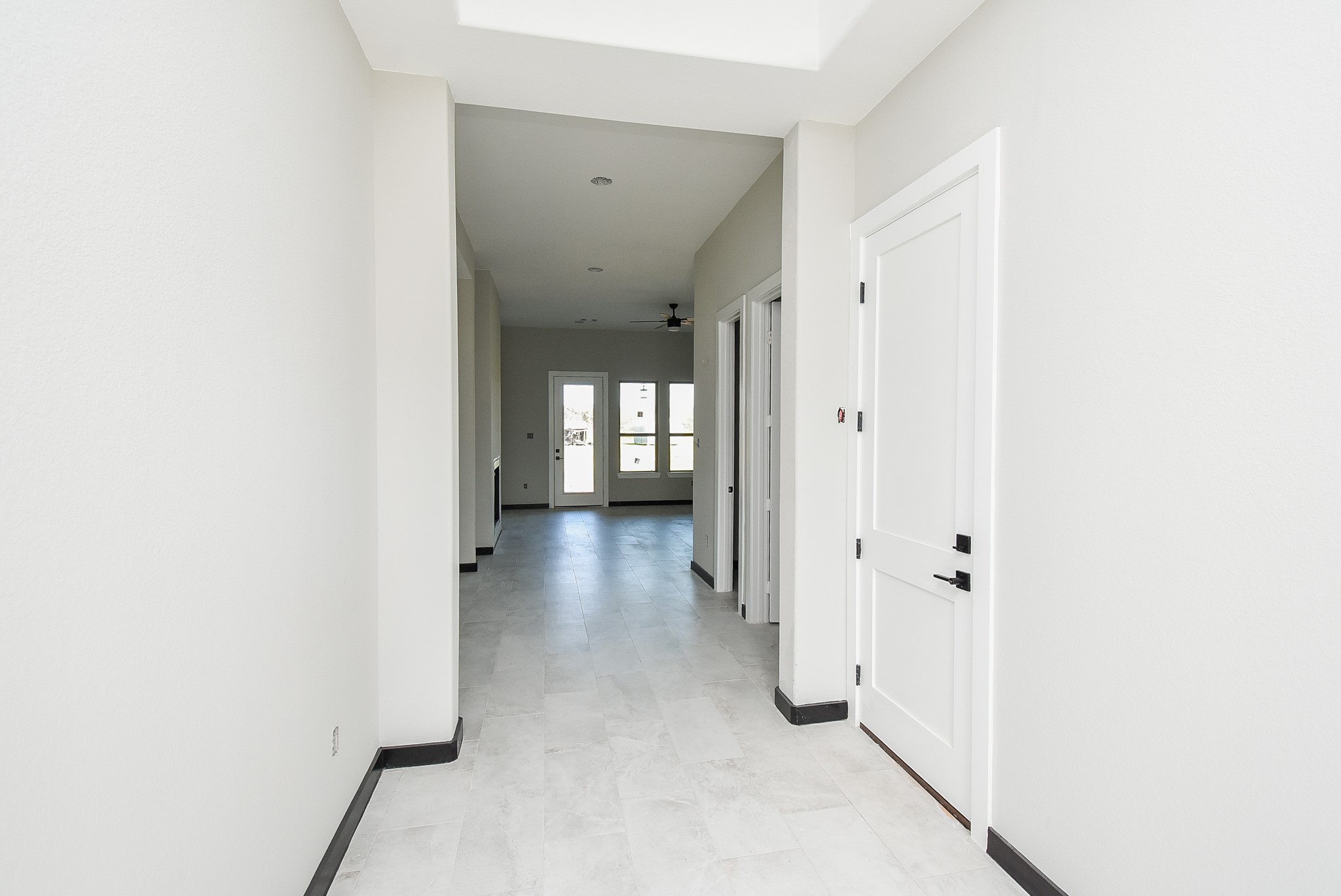 208 Silverleaf Road Sweeny, TX 77480 - Photo 15 of 49 a view of a hallway with wooden floor