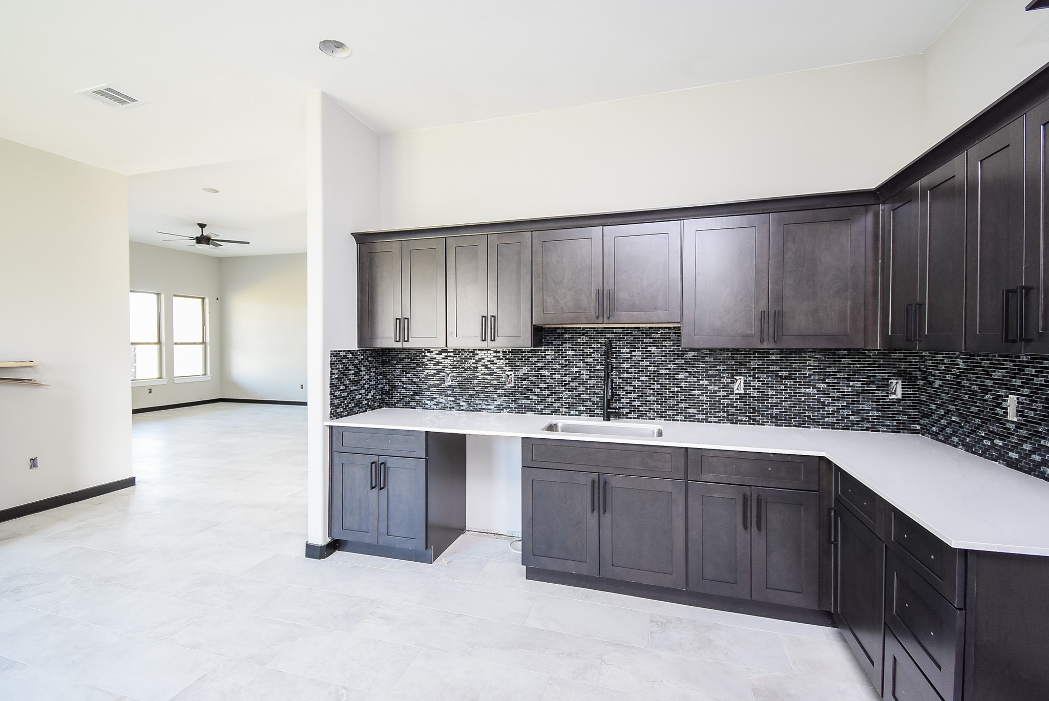 208 Silverleaf Road Sweeny, TX 77480 - Photo 16 of 49 a kitchen with a sink cabinets and wooden floor