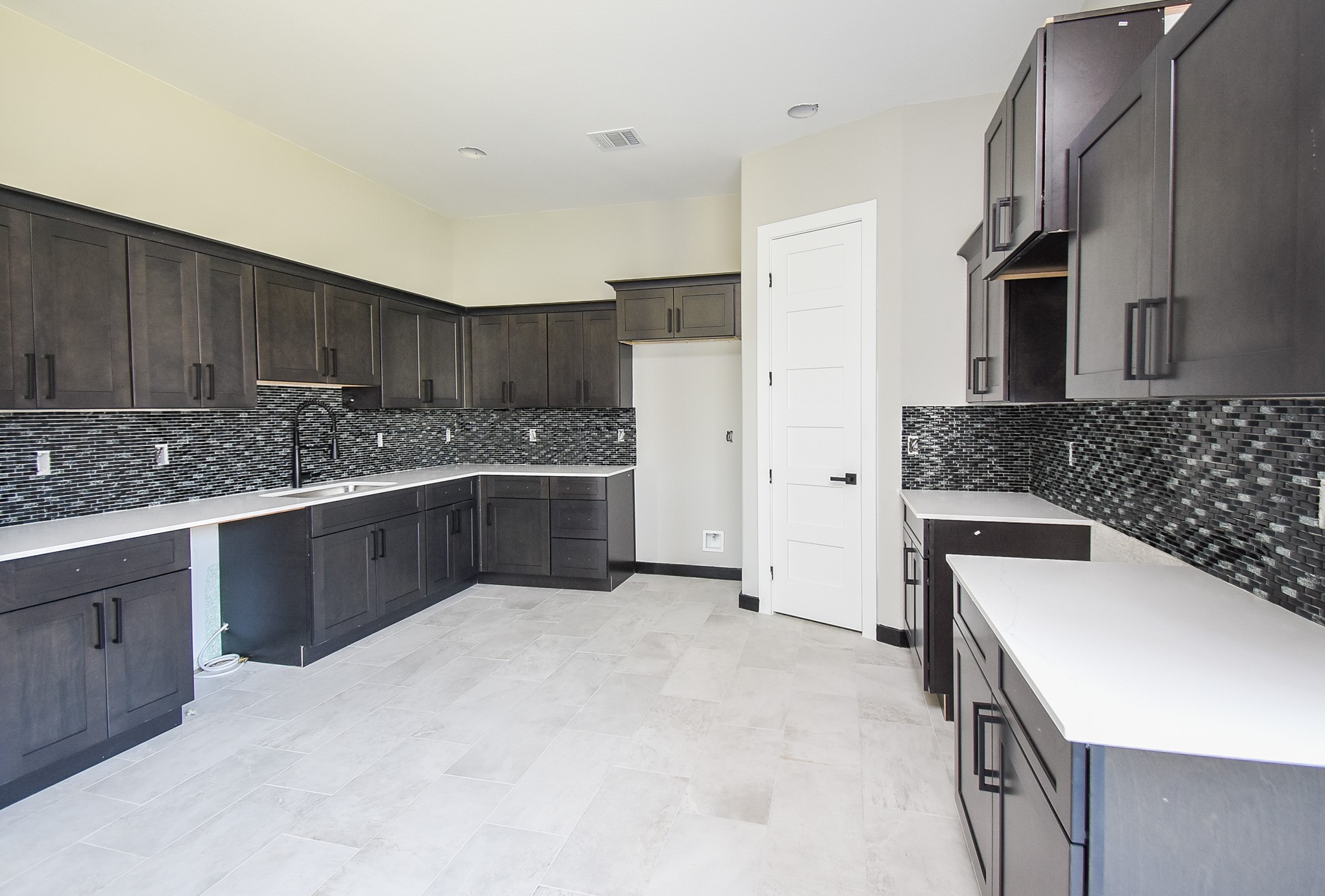 208 Silverleaf Road Sweeny, TX 77480 - Photo 21 of 49 a kitchen with a sink stove and refrigerator