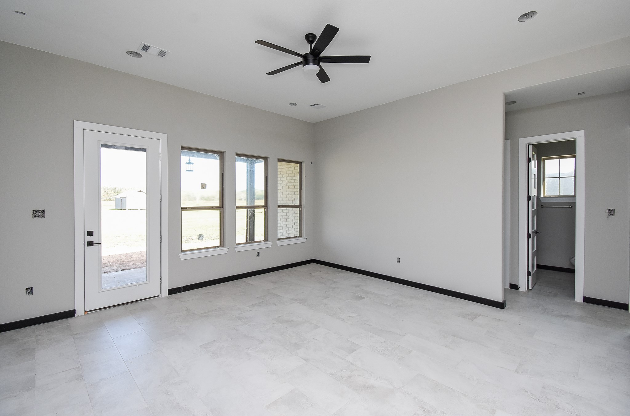 208 Silverleaf Road Sweeny, TX 77480 - Photo 22 of 49 a view of a livingroom with a ceiling fan and window