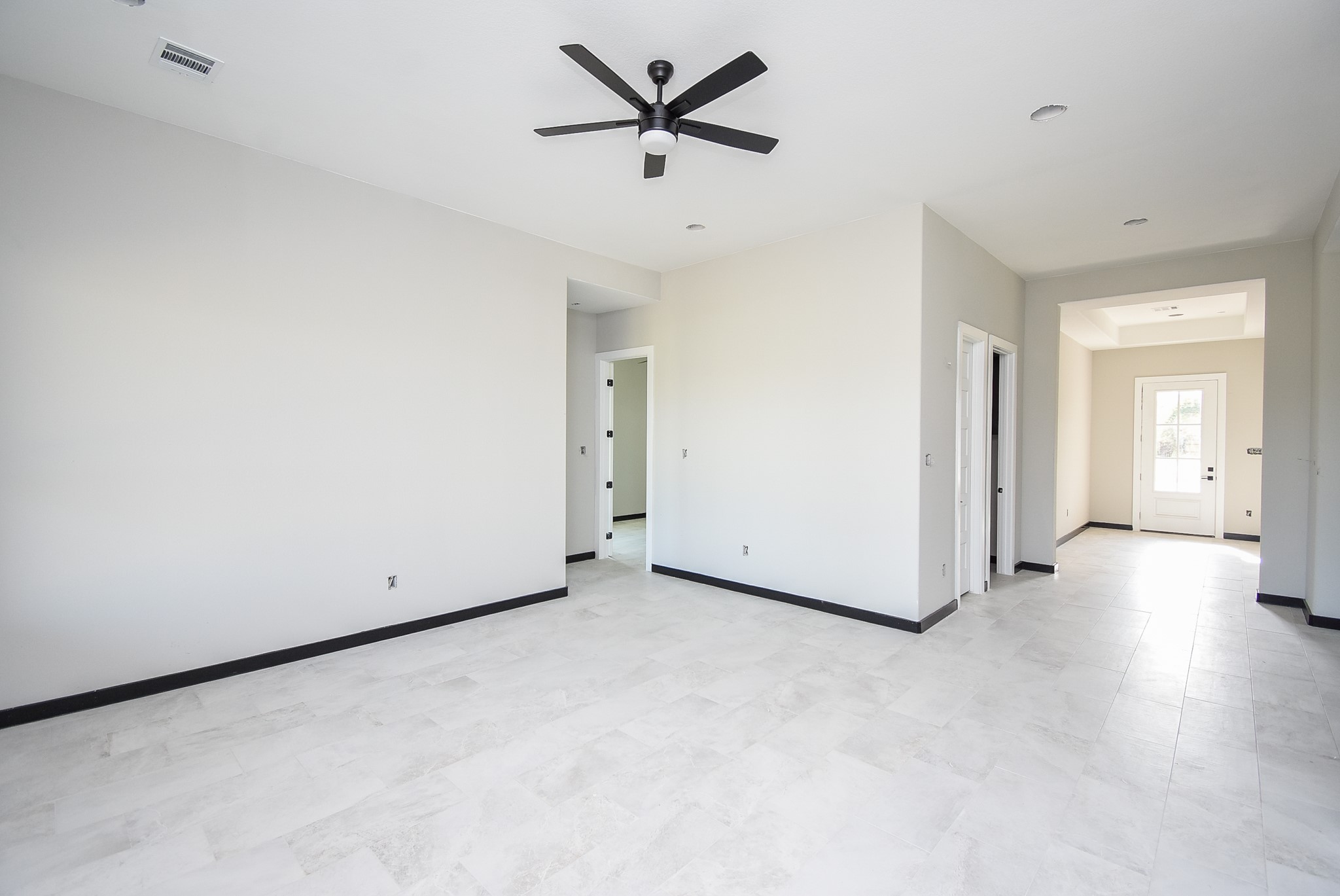 208 Silverleaf Road Sweeny, TX 77480 - Photo 23 of 49 a view of a livingroom with a ceiling fan and window