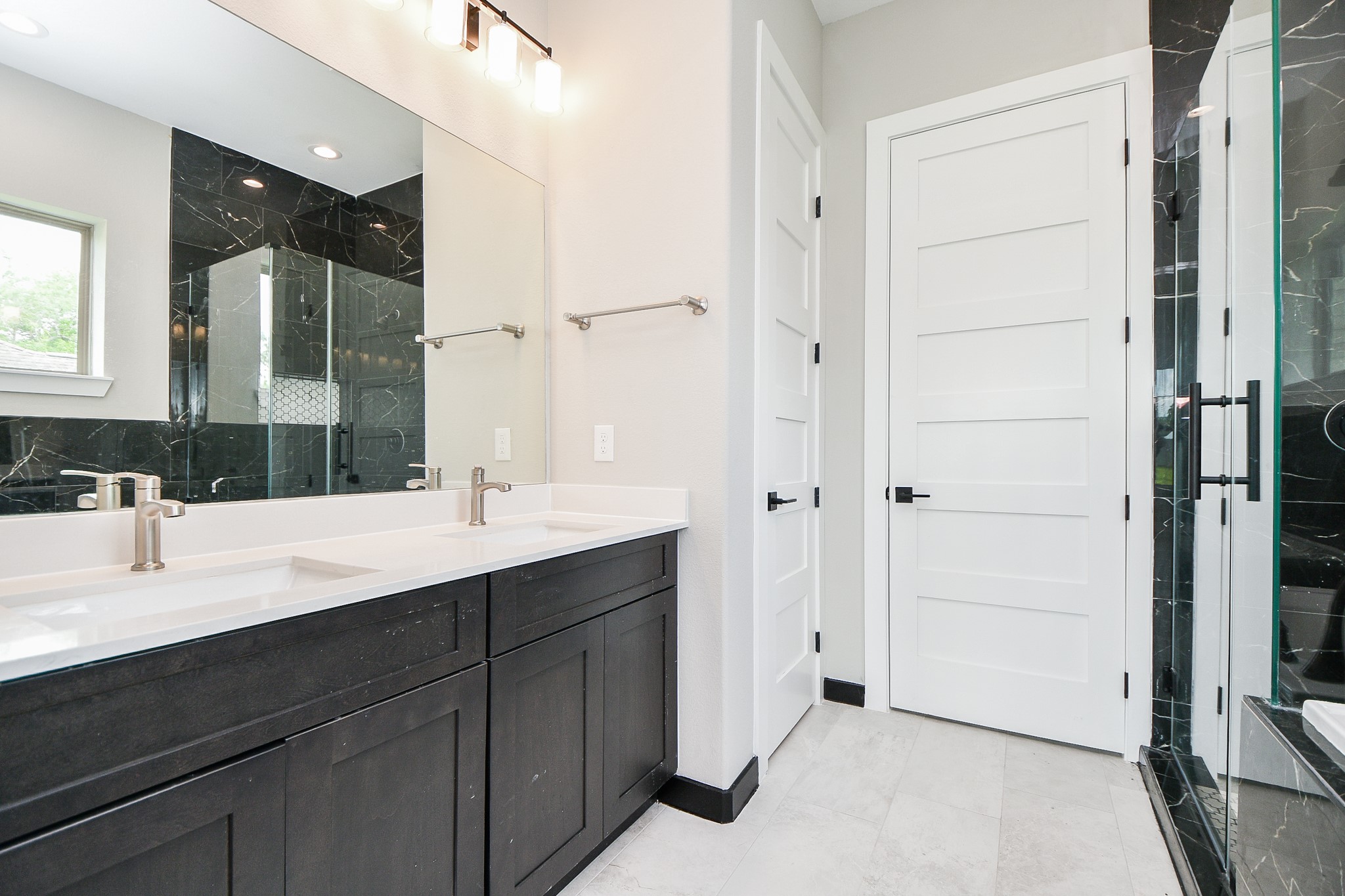 208 Silverleaf Road Sweeny, TX 77480 - Photo 33 of 49 a bathroom with a double vanity sink a mirror and a shower