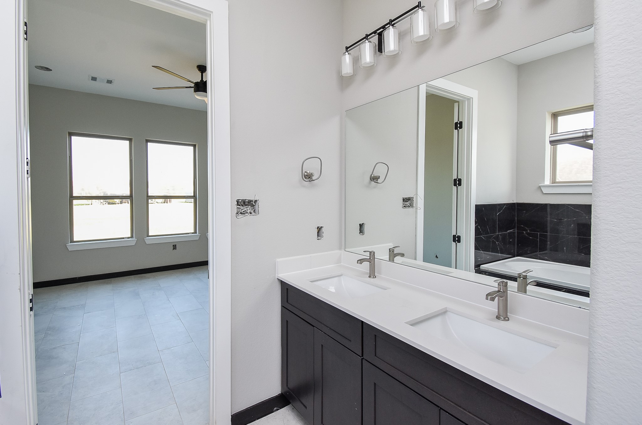 208 Silverleaf Road Sweeny, TX 77480 - Photo 35 of 49 a bathroom with a sink double vanity and a mirror