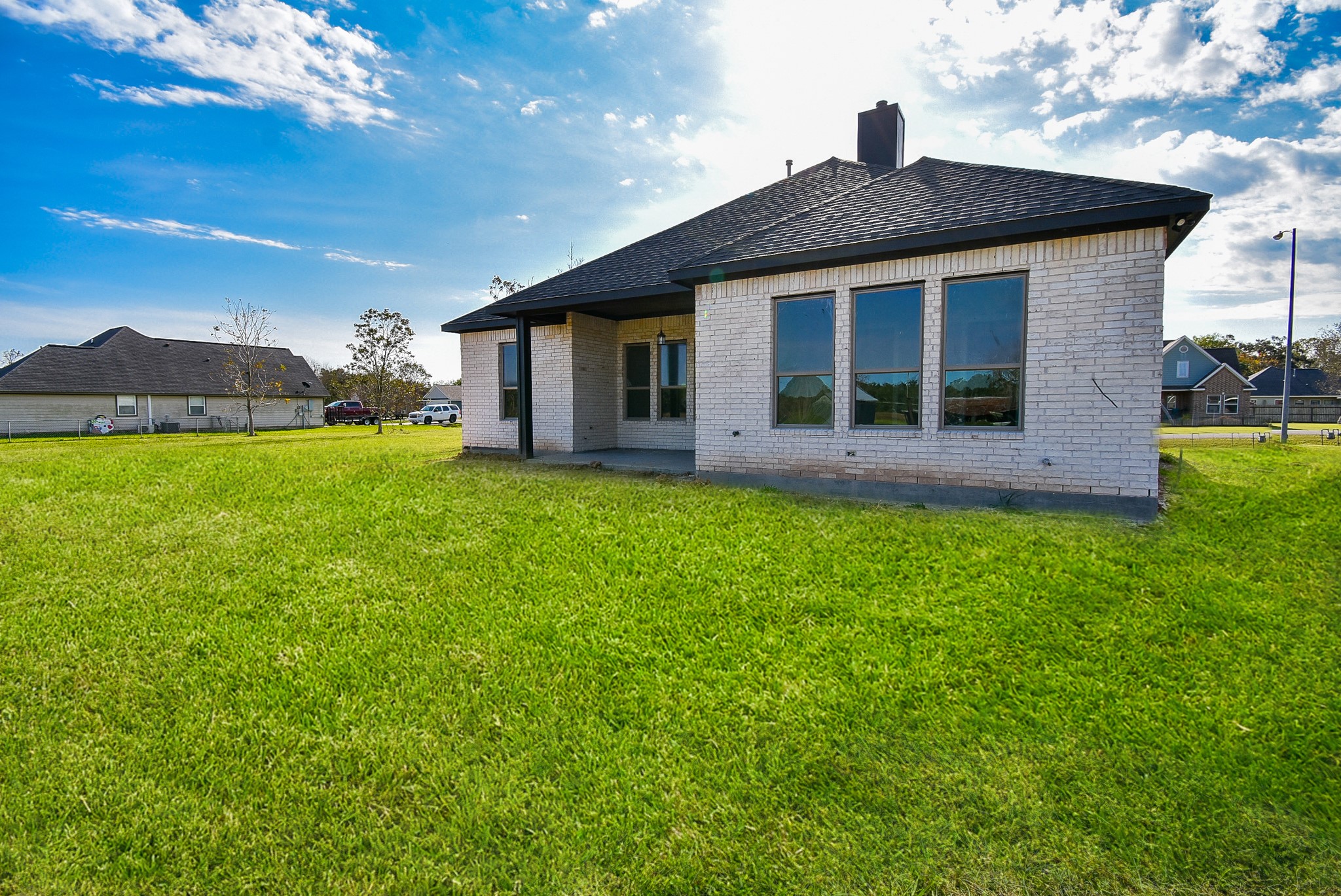 208 Silverleaf Road Sweeny, TX 77480 - Photo 47 of 49 a view of a house with a yard and a large tree