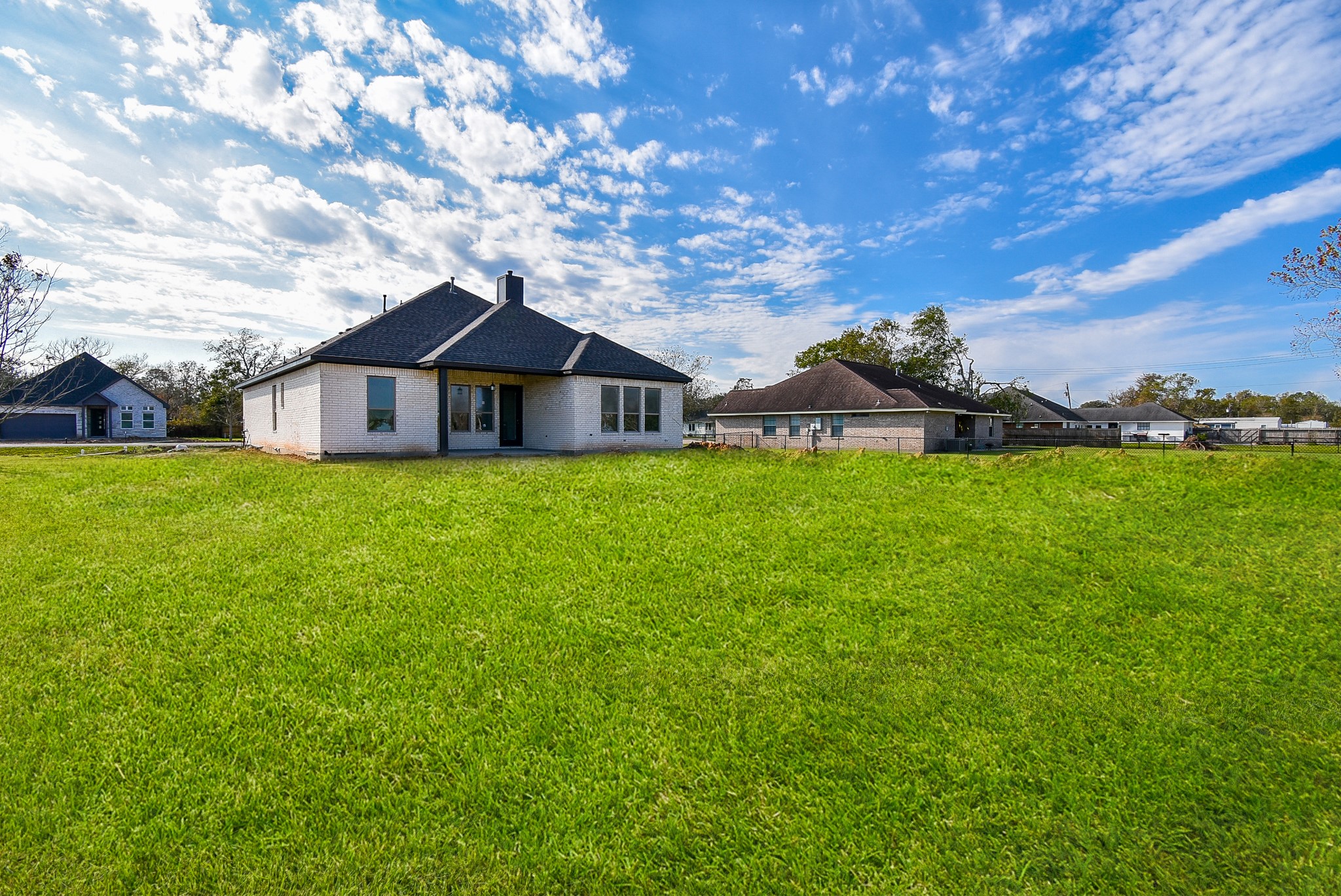 208 Silverleaf Road Sweeny, TX 77480 - Photo 49 of 49 a white house with a big yard and large trees