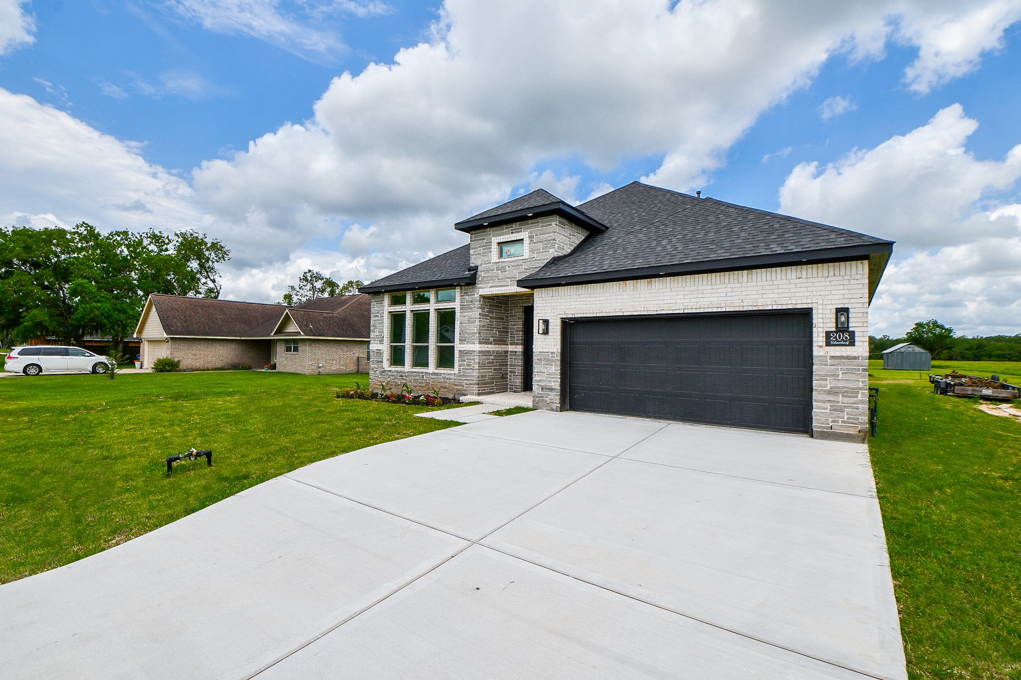 208 Silverleaf Road Sweeny, TX 77480 - Photo 7 of 49 a front view of a house with a yard